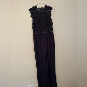 Navy Jumpsuit with lace detailing. Brand new with tags!